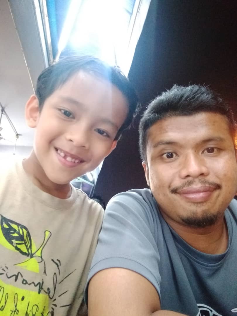 Muhammad Izdihar and dad